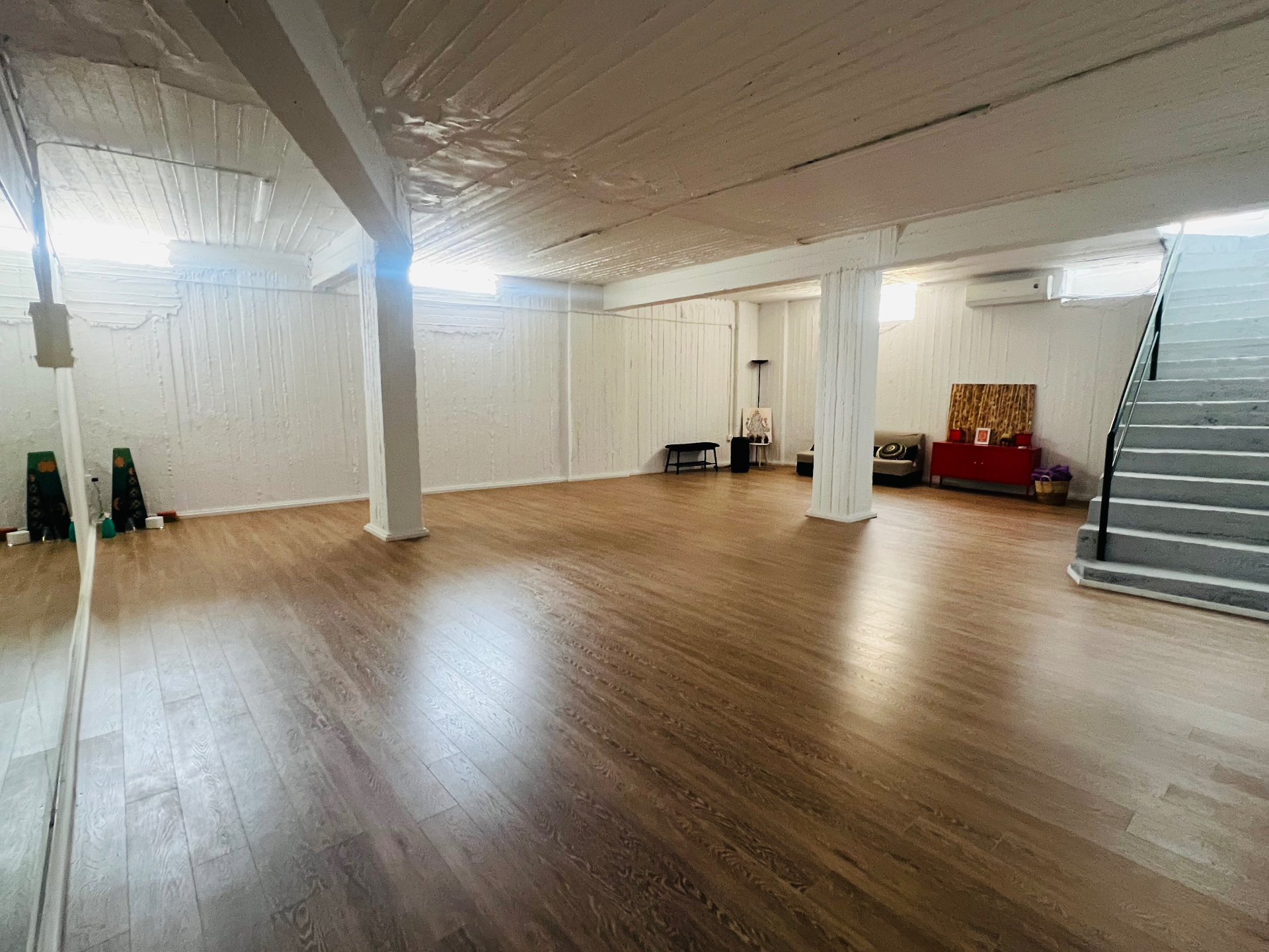 Dance Flame main hall with wooden floor, white walls and natural light